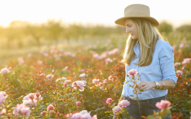 Felicia Alvarez of Menagerie Farm in the field at sunset