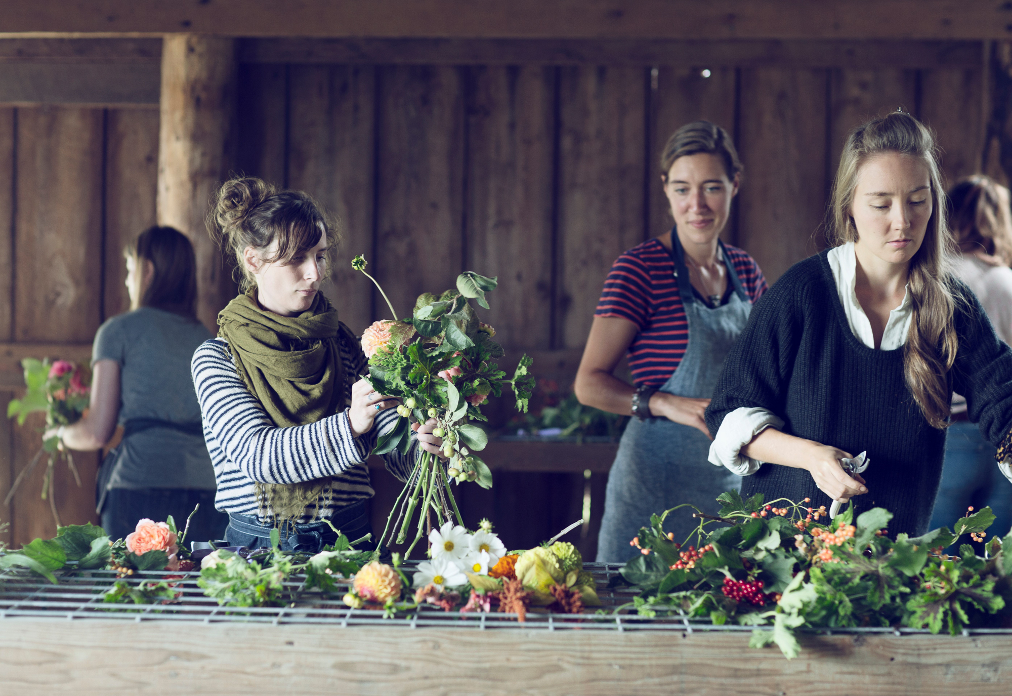 Students arranging flowers at a workshop